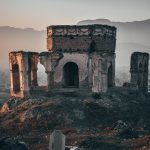 gray concrete building on top of hill