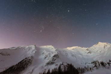 mountain covered snow under star