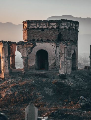 gray concrete building on top of hill