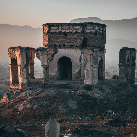 gray concrete building on top of hill